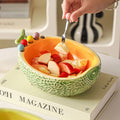 High-style cantaloupe ceramic fruit platter and fork set, perfect for home use. includes fruit picks, dessert forks, and a storage bowl, ideal for the living room coffee table
