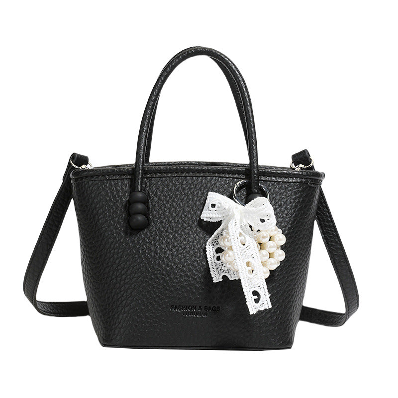 High sense fashion simple portable bucket bag women's 2025 spring and summer new casual simple solid color shoulder messenger bag