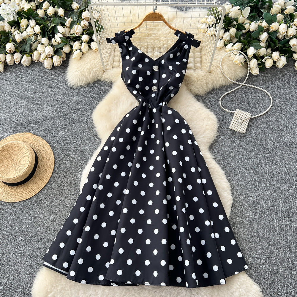 French high-end women's dress - autumn  collection: elegant bow-embellished camisole dress with cinched waist, flared hem, and polka dot detail - a flattering, flowy maxi dress
