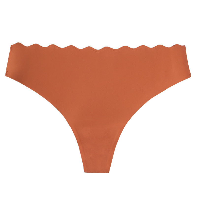 European and american  low-waist seamless ice silk underwear one-piece adhesive pure color cut out wavy waist women's underwear