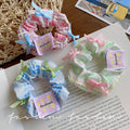 Blue sweet floral bow scrunchie hair tie - wholesale hair bands for ponytails, buns, and updos