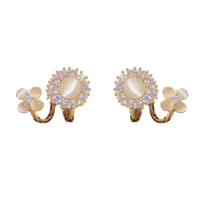 Luxury fashion floral earrings - unique studs, geometric ear cuffs, and accessories featuring geometric floral design details