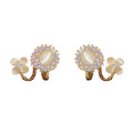 Luxury fashion floral earrings - unique studs, geometric ear cuffs, and accessories featuring geometric floral design details