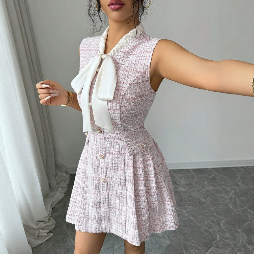 european and american new style pink sleeveless chanel-inspired dress with bow, stand collar, pearl buttons, cinched waist, and a-line silhouette