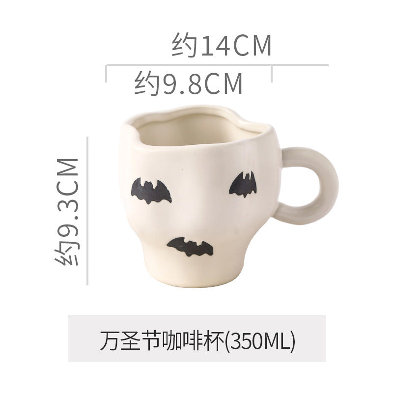 Creative halloween-themed ceramic cup and saucer set, featuring an irregular design with pumpkin and bat motifs. perfect for coffee or tea