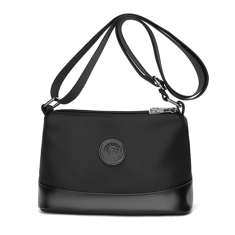 Cross-border color contrast trend women's bags, new casual and light commuting Oxford cloth shoulder bag, three-layer large-capacity messenger bag
