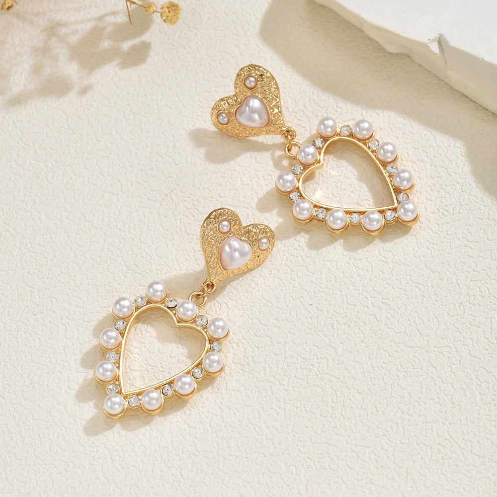 European and american cross-border casual sweet heart pearl earrings - light luxury, high-end, elegant, versatile, hollow heart stud earrings for women