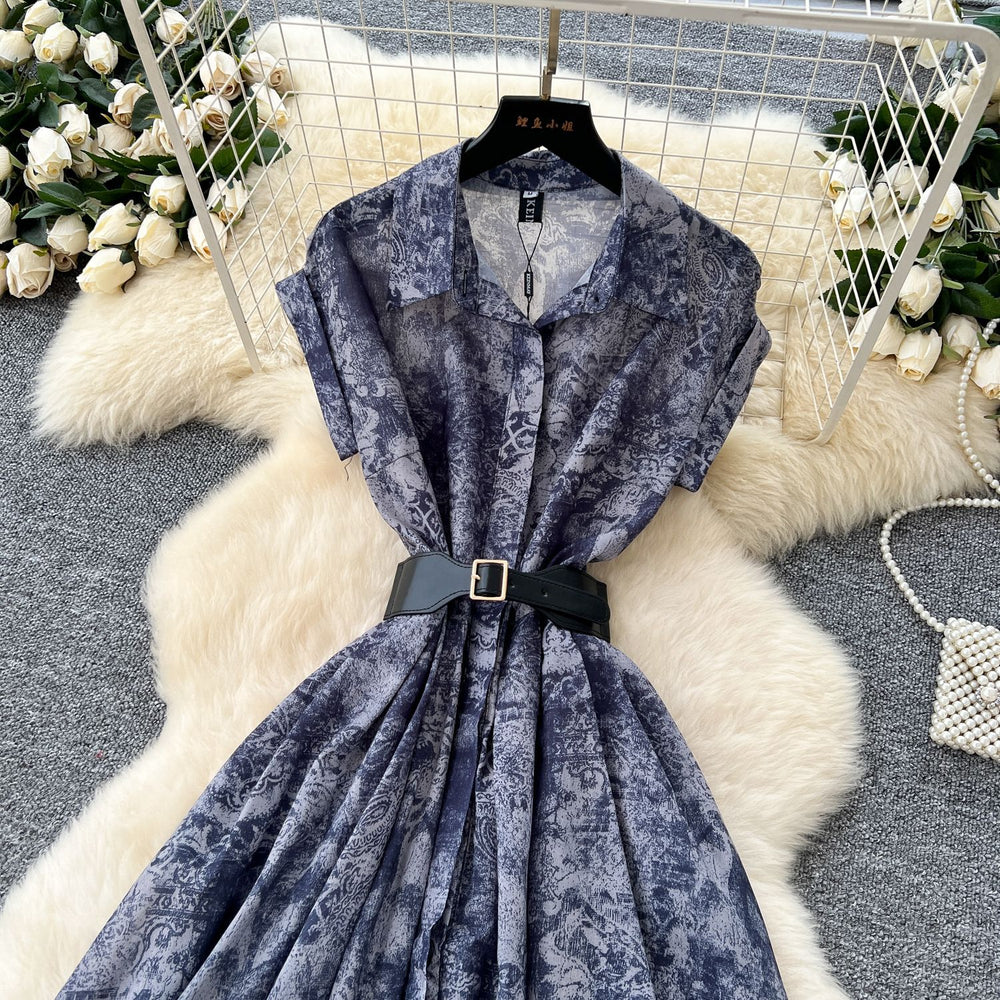 French chic, sophisticated, and unique: tie-waist, short-sleeve, single-breasted, fashionable printed pleated shirt dress with a touch of class
