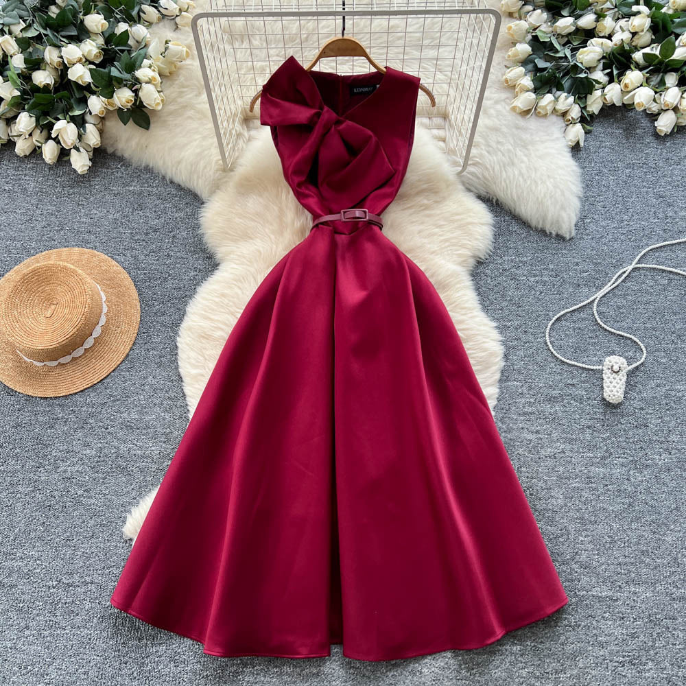 High-end women's french style formal dress - elegant, sleeveless, v-neck, cinched waist, slimming, and flattering a-line maxi dress with 3d bow detail