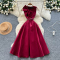 High-end women's french style formal dress - elegant, sleeveless, v-neck, cinched waist, slimming, and flattering a-line maxi dress with 3d bow detail
