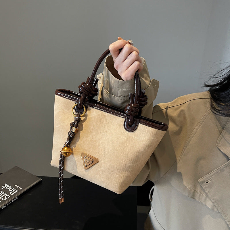 Retro new design Korean light luxury foreign fashion portable bucket bag versatile high sense women commuter messenger bag