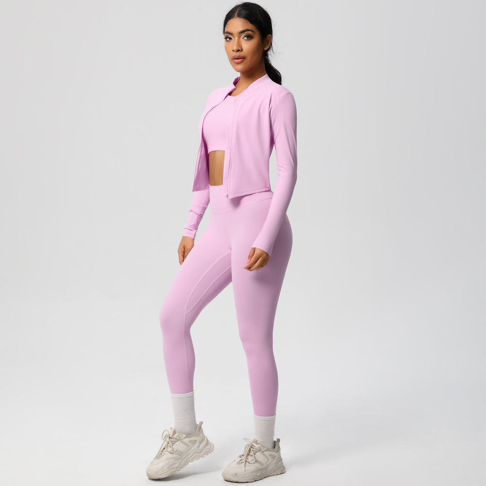 High-waisted, form-fitting yoga pants, a barely-there feel, quick-drying outer layer, and a long-sleeved tee – a women's three-piece activewear set perfect for running and workouts