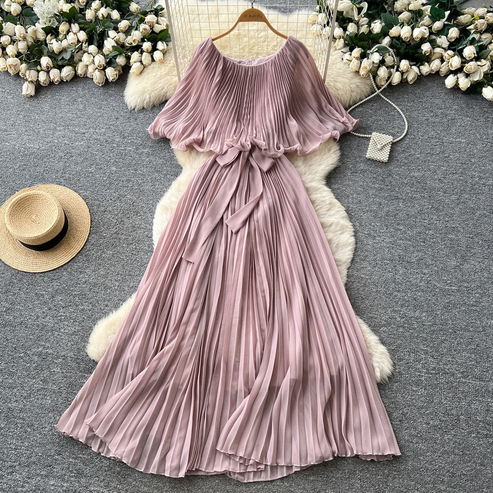 French-inspired pleated dress for women, featuring a bow tie, off-the-shoulder design, tie-waist, and flattering pleats for an elegant and sophisticated look