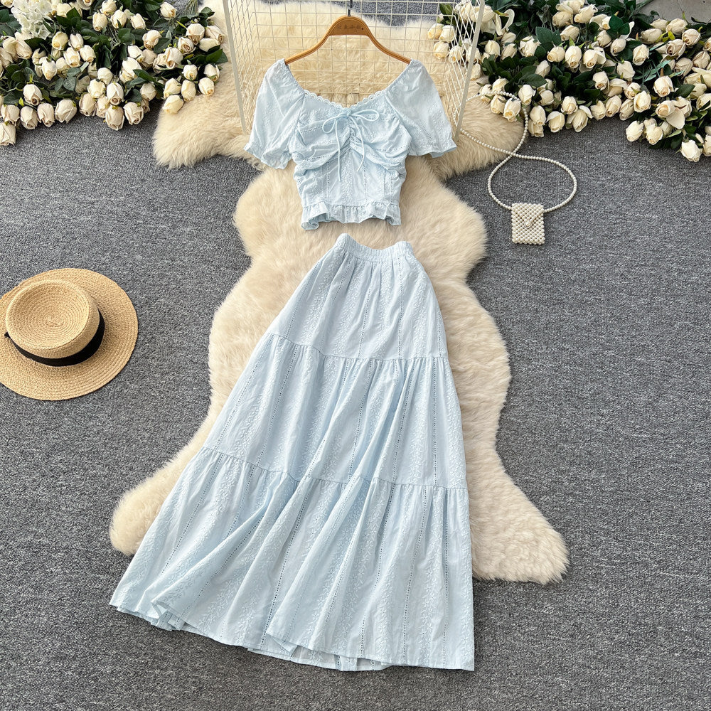 Korean-inspired, stylish and chic women's two-piece set featuring a puff-sleeve, square-neck top and a high-waisted, figure-flattering midi skirt