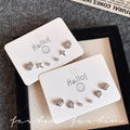 Sweet and cool style multi-pair set of heart-shaped starburst stud earrings, exquisite zircon combination earrings, niche high-end elegant earrings