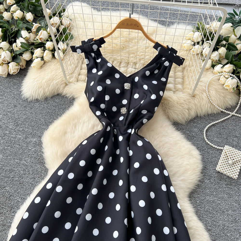 French high-end women's dress - autumn  collection: elegant bow-embellished camisole dress with cinched waist, flared hem, and polka dot detail - a flattering, flowy maxi dress