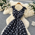 French high-end women's dress - autumn  collection: elegant bow-embellished camisole dress with cinched waist, flared hem, and polka dot detail - a flattering, flowy maxi dress