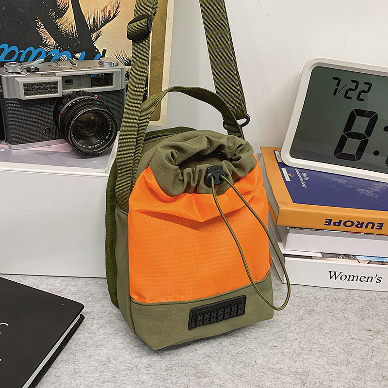 Foreign trade cute contrasting color draw belt small bag women 2025 new versatile sports and leisure shoulder messenger bag cloth bag