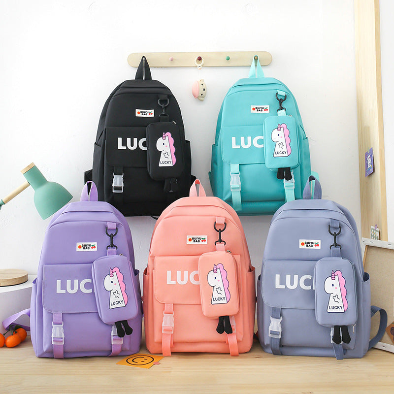 Manufacturer wholesale schoolbag female primary and secondary school students four-piece set third grade Korean version small fresh large capacity backpack to reduce the burden