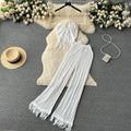 Bohemian beach vacation set for women: summer knit tassel halter top and high-waisted cutout pants two-piece outfit