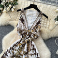 Bohemian vacation style retro deep v-neck tie-up sleeveless cinched waist elegant printed ruffle hem dress