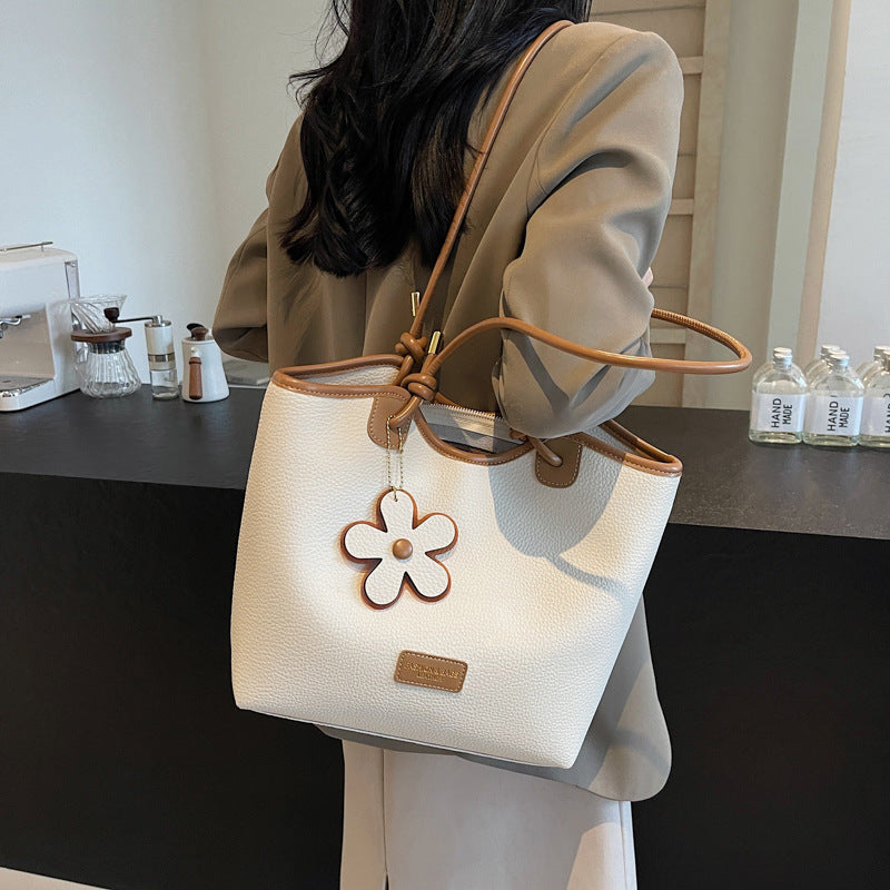 Hand carry versatile bucket bag women's bag 2025 new fashion texture shoulder bag casual foreign style messenger bag