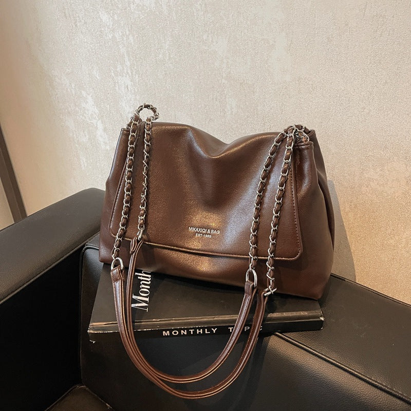 Solid color simple large-capacity foreign gas bag women's 2025 new trendy underarm commuter chain single shoulder tote bag