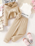 spring girls' casual three-piece set: pink hooded sweatshirt, high-neck tank top, letter print sweatshirt, and pants