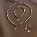 European and american cross-border light luxury retro faux pearl necklace, minimalist chic diamond-studded sun pendant earrings and bracelet set