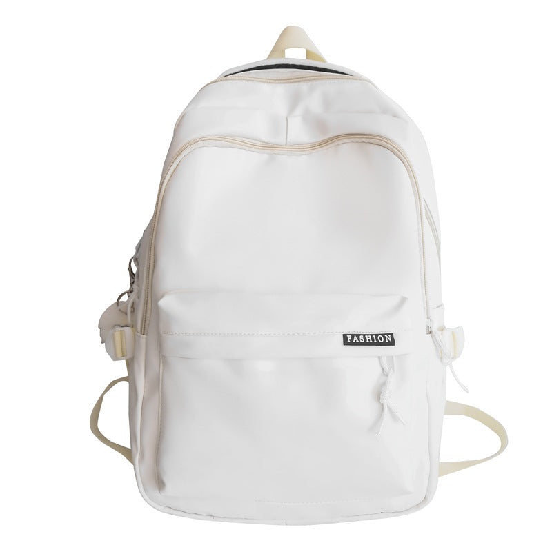 Large capacity burden reduction solid color backpack male junior high school student primary school bag female simple versatile travel backpack