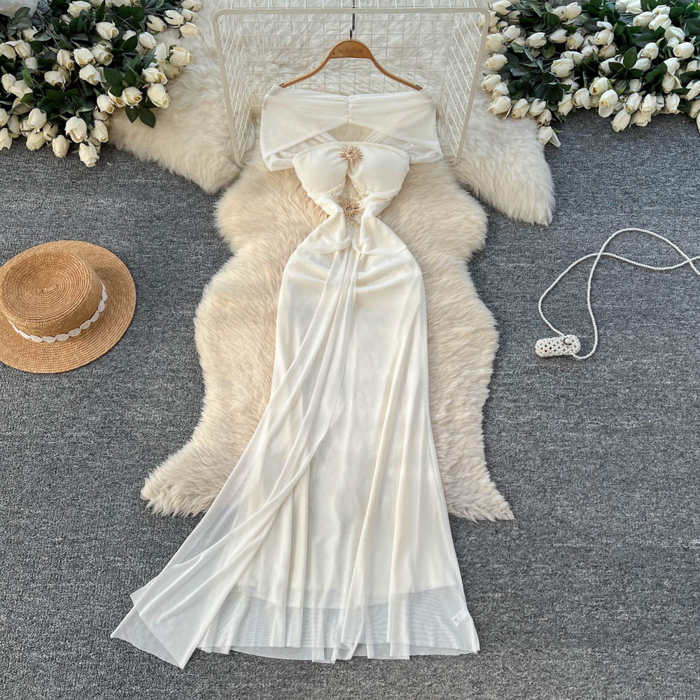 Luxury chic women's french-style one-shoulder bandeau dress with metal buckle, cinched waist, and flowing ribbon mesh detail