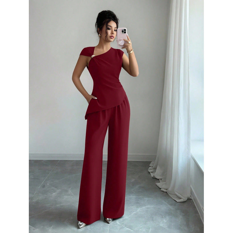 Women's elegant sleeveless fitted top with metal accents and asymmetrical hem, paired with loose straight-leg pants - 2-piece set