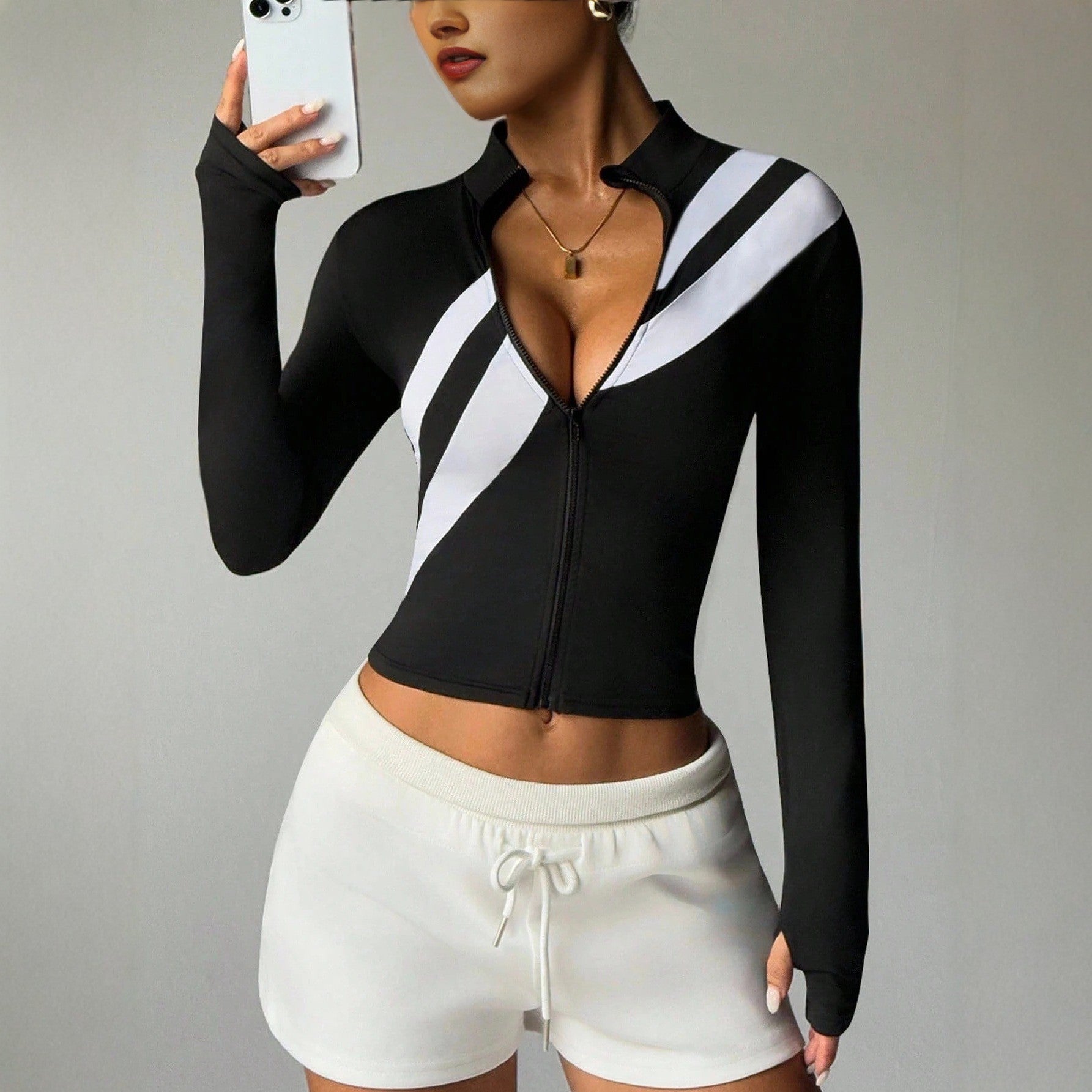 Pre-sale black and white contrasting color stand-up collar full zipper sports jacket women's oblique striped short waist thumb hole long-sleeved top