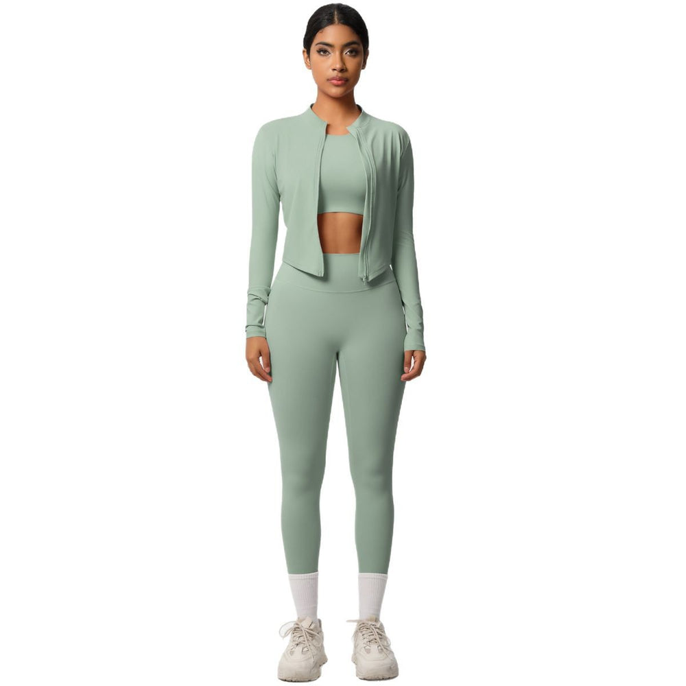High-waisted, form-fitting yoga pants, a barely-there feel, quick-drying outer layer, and a long-sleeved tee – a women's three-piece activewear set perfect for running and workouts