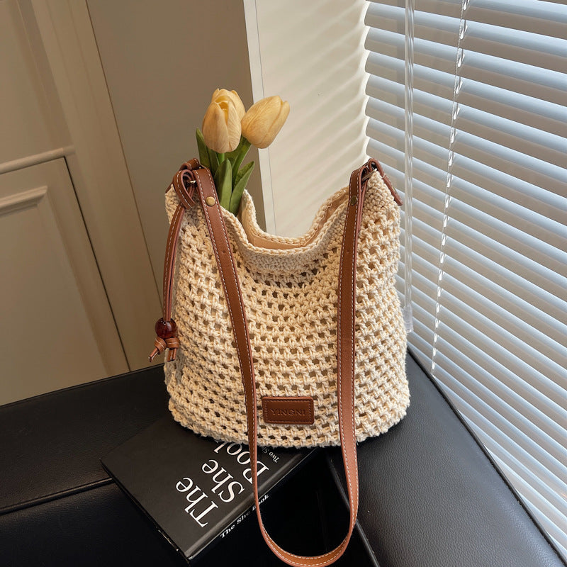 Holiday knitted bag women's 2025 summer new commuter shoulder messenger bag hollow woven bucket bag wholesale