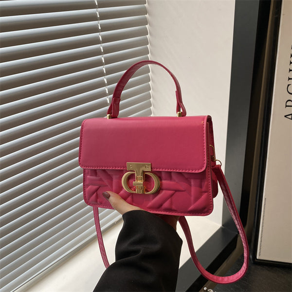 Trendy solid color 2025 new large-capacity indentation lock fashionable women's retro portable shoulder oblique span women's bag