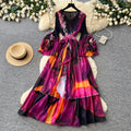 Vacation-style purple floral print dress for women, spring long-sleeved high-waisted a-line dress with a cinched waist and ruffle hem maxi skirt