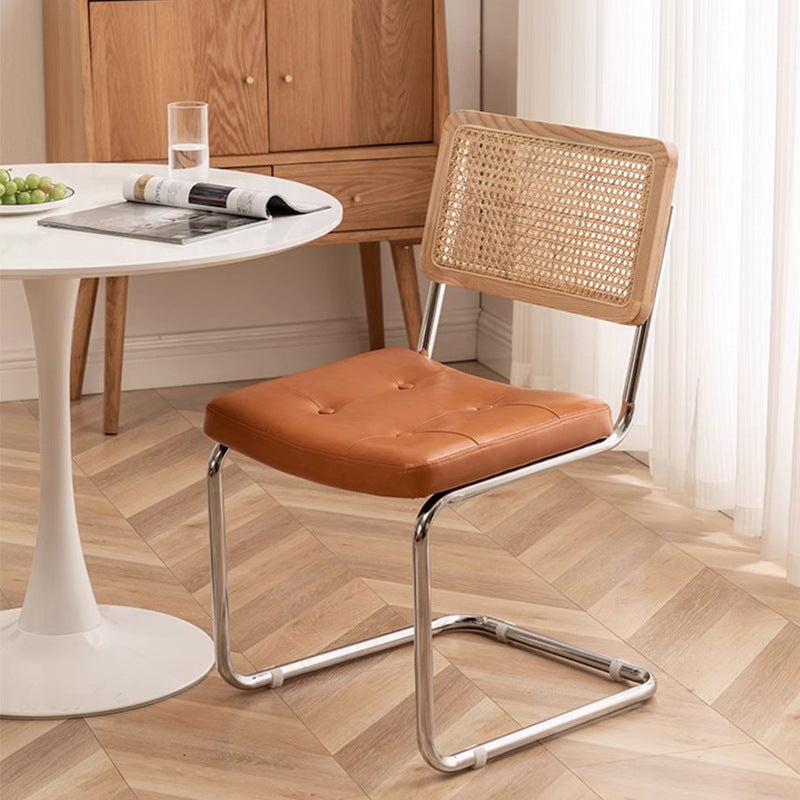 Rattan dining chair - luxury, high-end design with curved backrest - modern minimalist woven rattan chair
