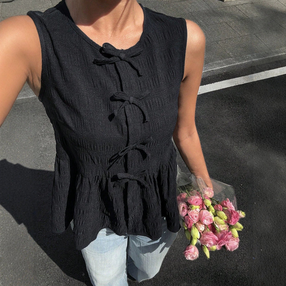 summer new arrival: sleeveless tank top with bow detail, cinched waist, slimming fit, and ruffle hem – a flattering and chic top