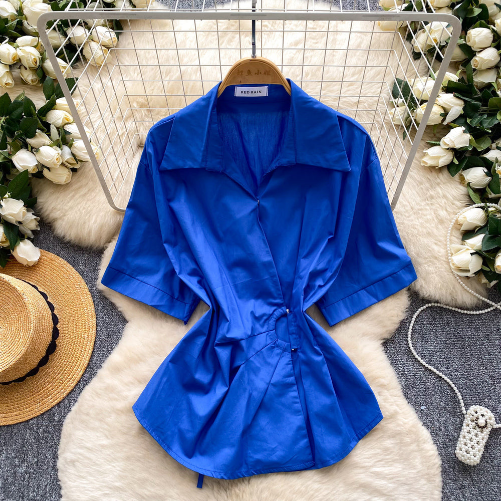 Korean-inspired, design-forward, cinched-waist blouse for women. spring collection, short-sleeved, relaxed-fit, open-front cardigan. elegant and sophisticated, with a touch of french flair