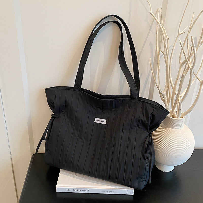 Cross-border casual tote bag, simple personality and large capacity fashion women 2025 summer commuting lazy wind messenger bag women