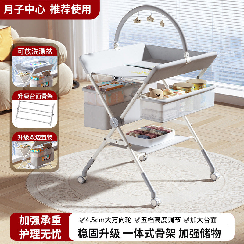 Baby changing table - newborn diaper changing, bathing, and massage station - foldable multifunctional baby bed