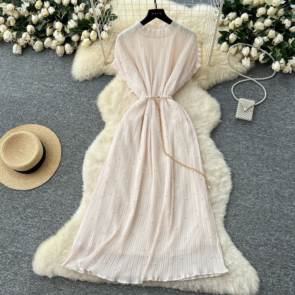 French-inspired v-neck floral chiffon dress with flared sleeves, tie waist, and a figure-flattering, vintage-inspired silhouette