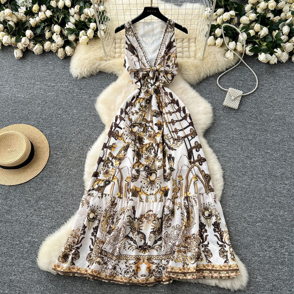 Bohemian vacation style retro deep v-neck tie-up sleeveless cinched waist elegant printed ruffle hem dress