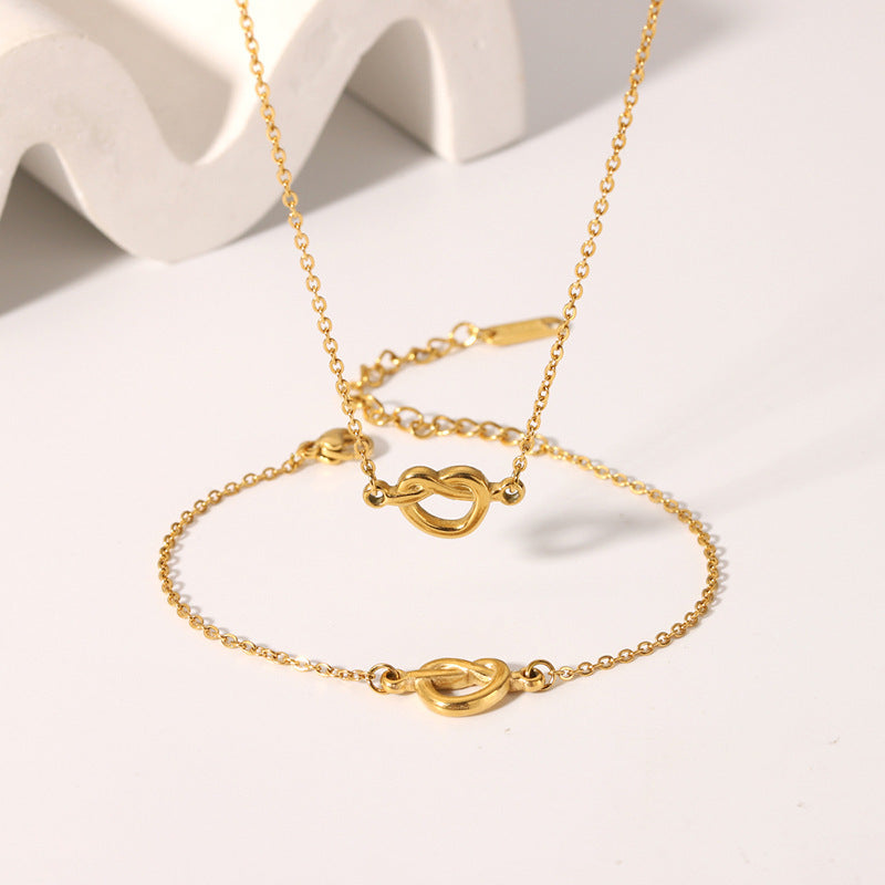 European and american fashion ins minimalist 18k gold plated knotted necklace titanium steel short rope cross pendant four-piece jewelry set