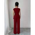 Women's elegant sleeveless fitted top with metal accents and asymmetrical hem, paired with loose straight-leg pants - 2-piece set