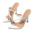 White pointed-toe thong sandals for women, featuring delicate straps, a high heel, and a metal buckle. a niche, european and american design with a touch of understated luxury, perfect for everyday wear
