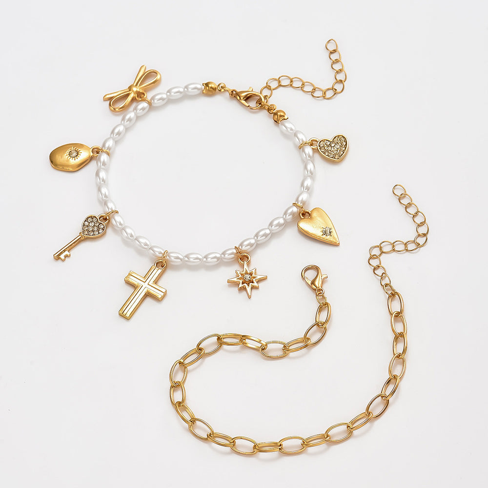 Wholesale faux pearl bracelets - european & american style, stackable, designer jewelry with cross, heart, bow, and star charms
