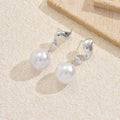 European and american cross-border creative pearl stud earrings: high-end geometric spiral flame, unique and elegant vintage earrings for women