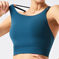 eco-friendly sports bra with thin straps, designed for yoga, running, and fitness. features built-in padding and is suitable for women